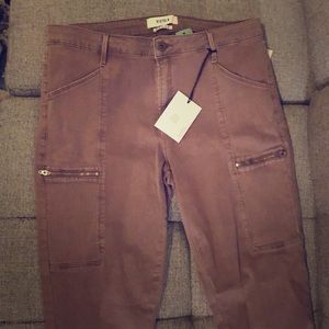 Dusty rose colored jeans with zipper details